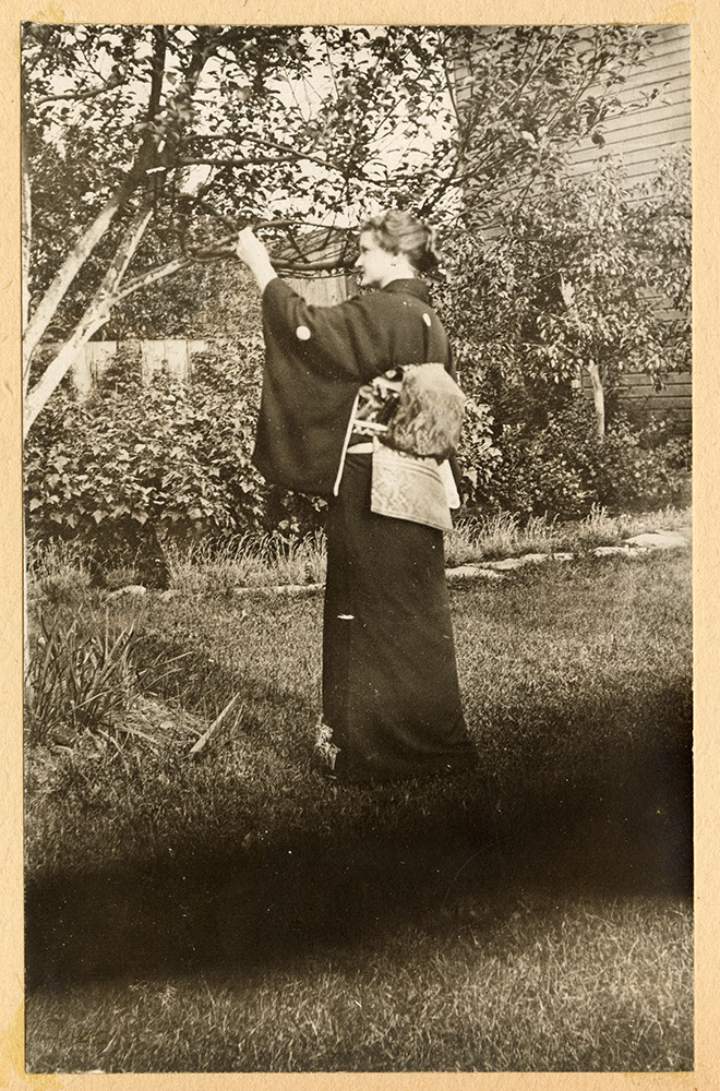 Miss Tompkins in kimono in the garden